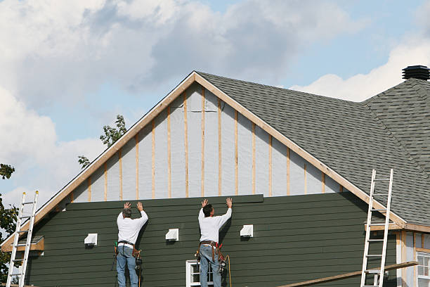 Professional Siding technician working in New Church, VA